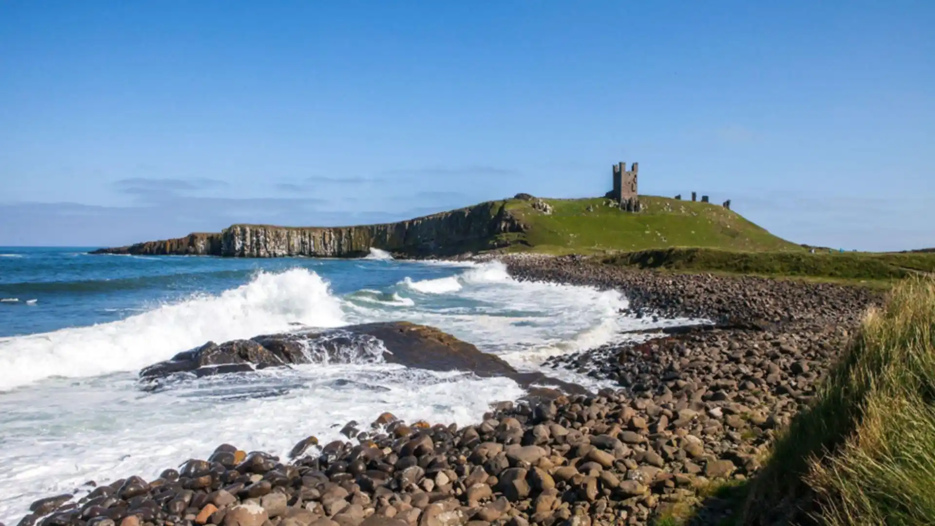 Dunstanburgh Castle on the cliffs between Craster and Embleton